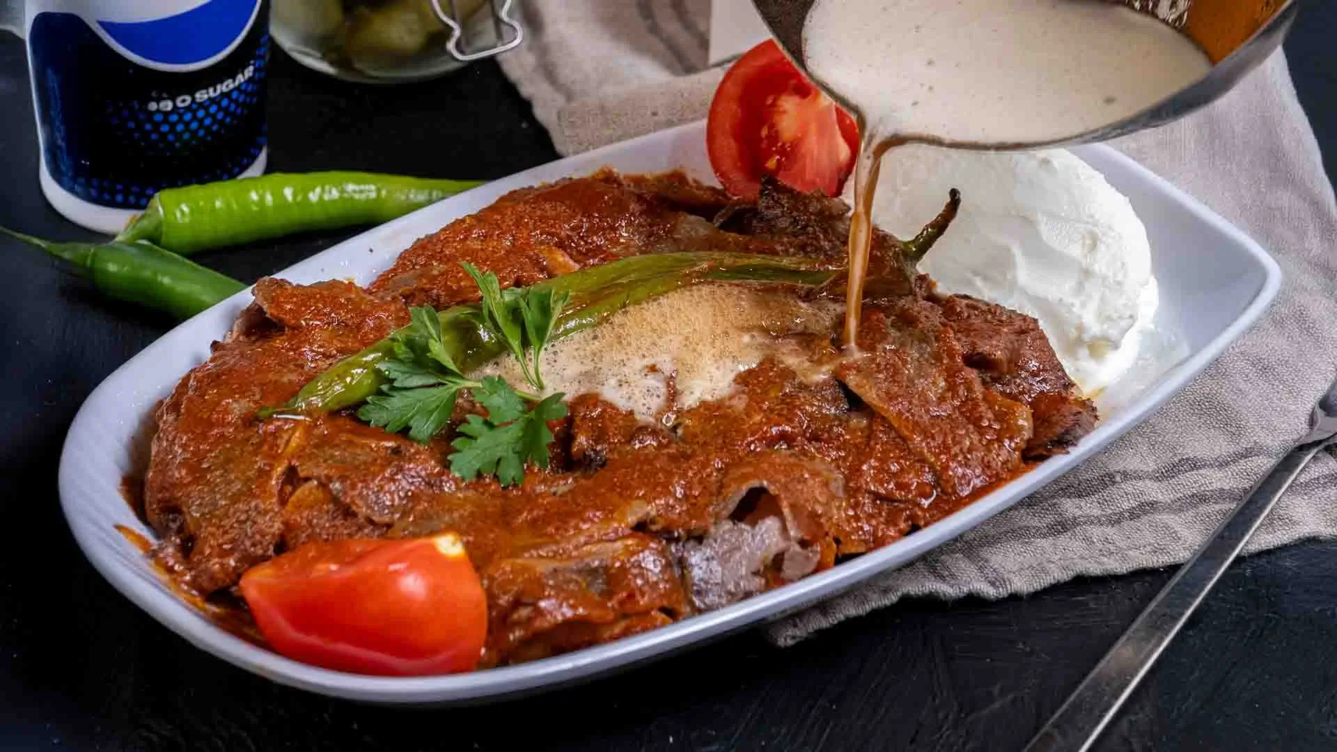İskender kebab – one of the most famous Turkish foods, from Bursa with sliced lamb, tomato sauce, melted butter, and yogurt