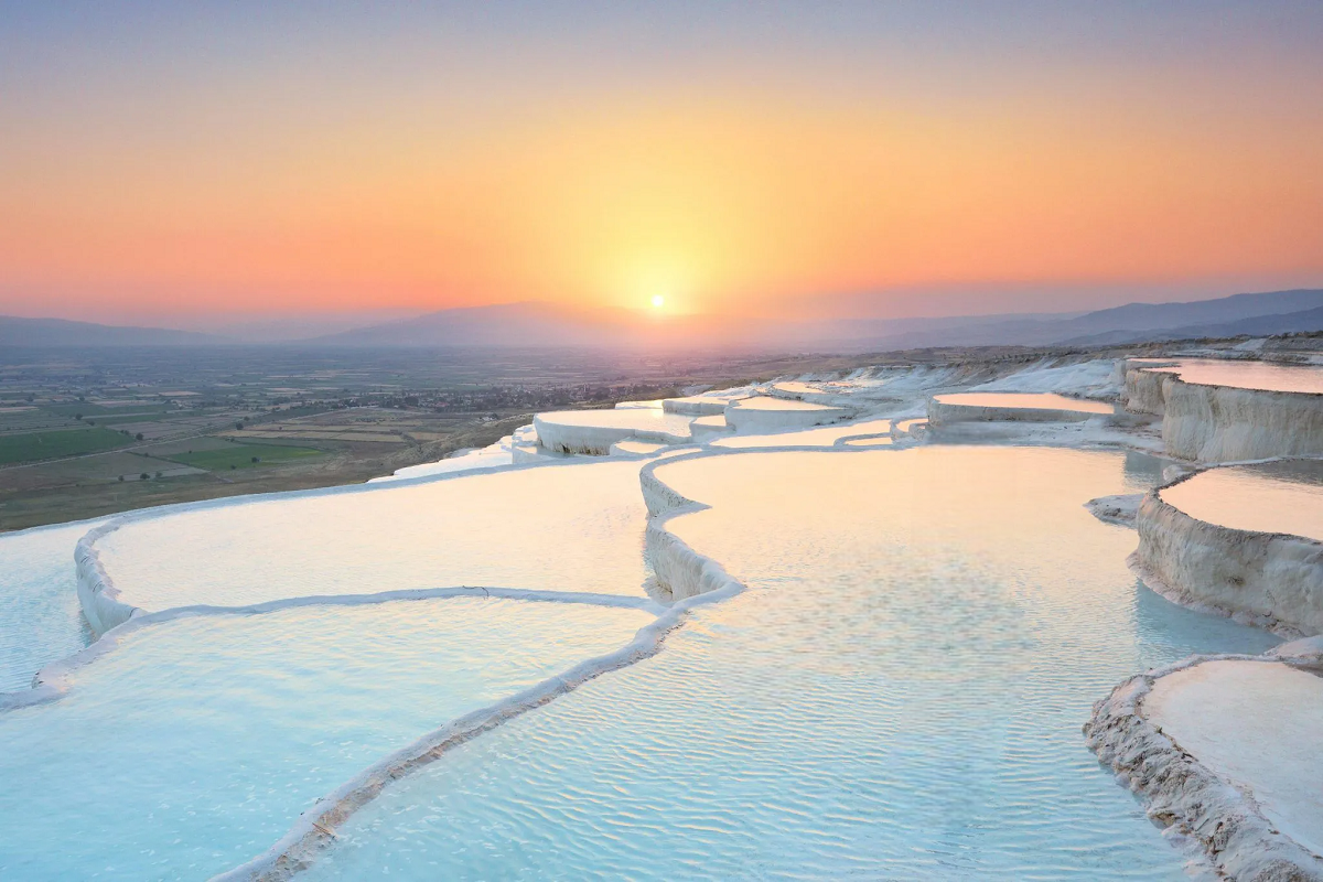 Golden Sunset over Pamukkale White Travertine Terraces Turkey Golden sunset light over Pamukkale white travertine terraces Turkey
