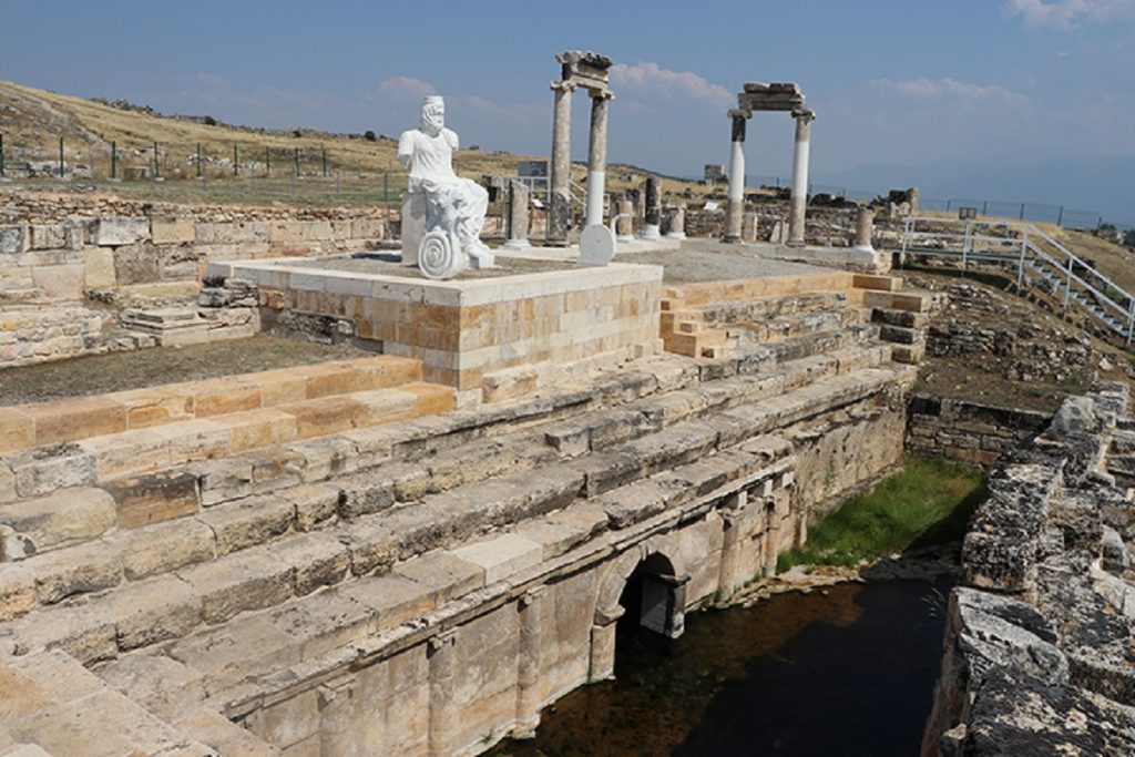 The Plutonium at Hierapolis Ancient Gate to the Underworld Pamukkale Turkey Hierapolis Plutonium cave entrance with steam rising from the ground Pamukkale Turkey