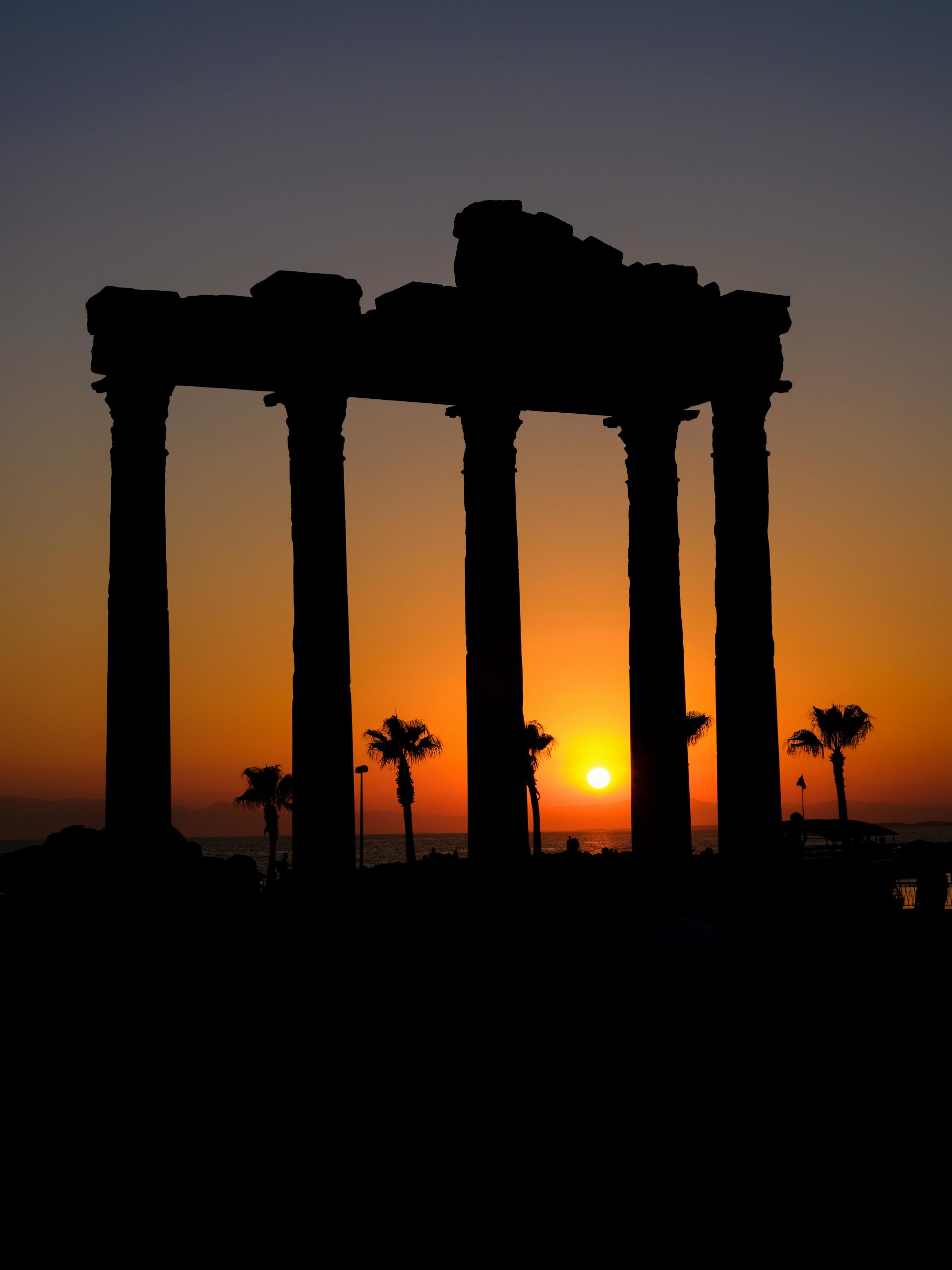 Roman Temple of Apollo columns silhouetted against the Mediterranean Sea in Side, Turkey