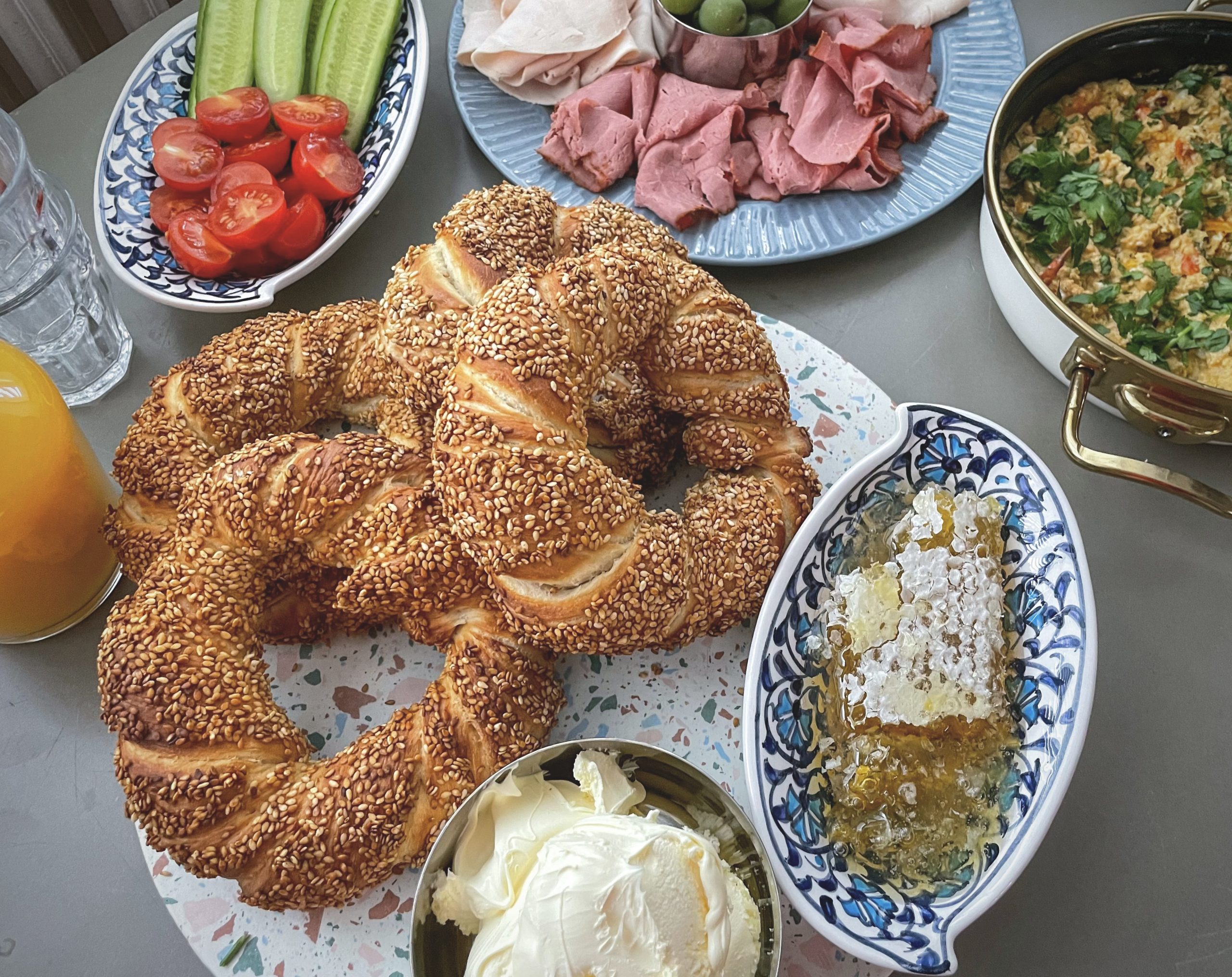 Stack of freshly baked Turkish simit sesame-crusted bread rings from a street cart