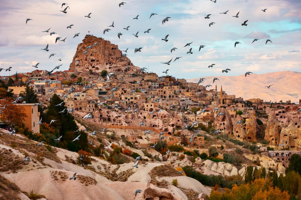 Pigeon Valley sunset in Cappadocia with carved cliff dwellings