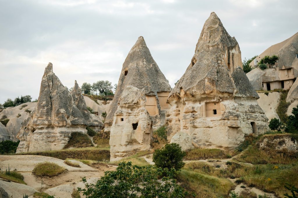 Cappadocia fairy chimney rock formations along a Rose Valley hiking trail without balloons