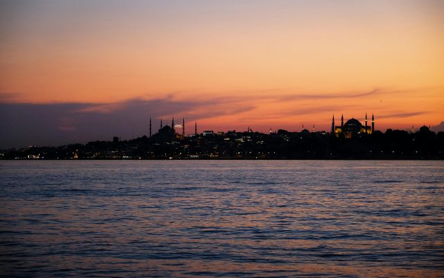 Istanbul 3 day itinerary featured view of Hagia Sophia and Blue Mosque skyline at sunset over the Bosphorus