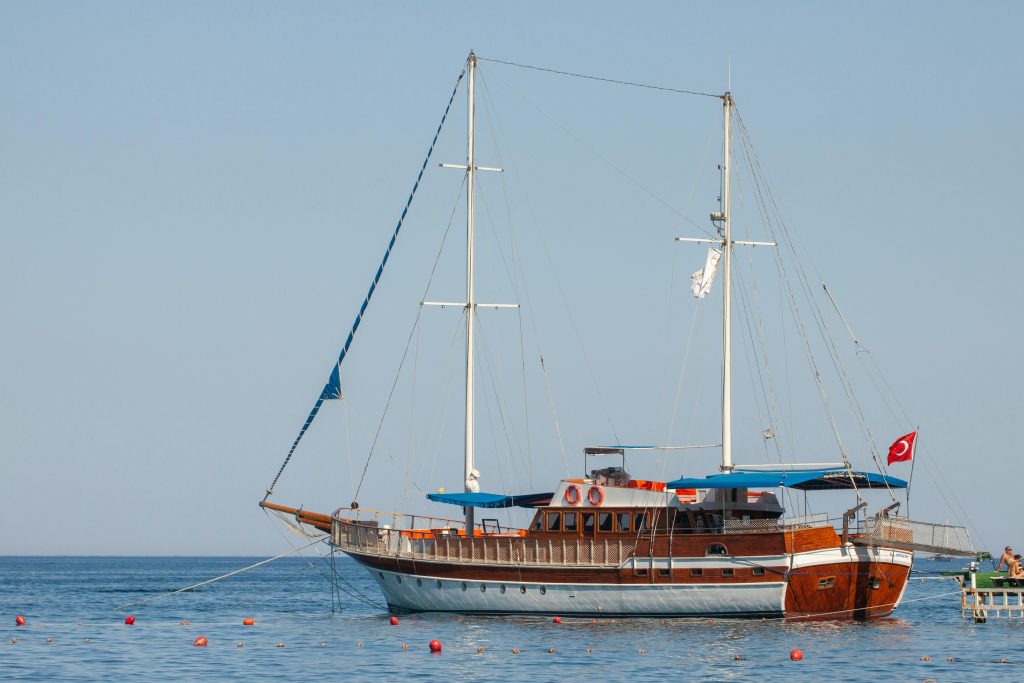 Boat docked at Kusadasi harbour for daily Aegean coast tours Turkey